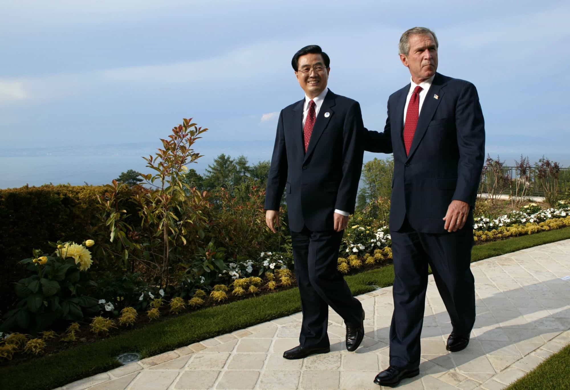 Chinese President Hu Jintao walks with U.S. President George W. Bush at a Group of Eight (G8) summit, in France, in 2003.