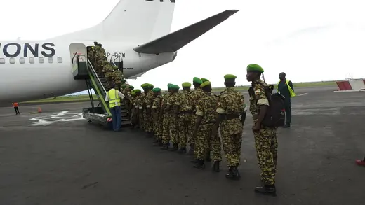 Burundian soldiers board a UN plane at Bujumbura International Airport to replace AMISOM troops in Somalia.