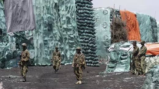 Kenyan and Somali soldiers take part in a joint patrol at a charcoal depository.