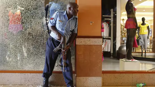 A police officer secures an area inside the Westgate Shopping Center, where al-Shabab gunmen went on a shooting spree.