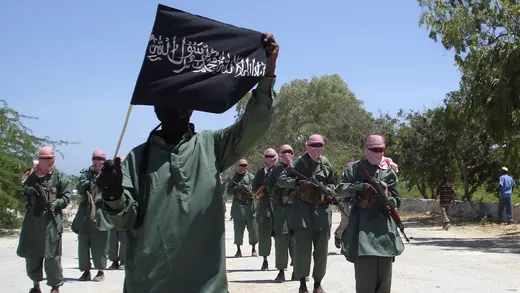 Al-Shabab fighters march on the outskirts of Mogadishu. 